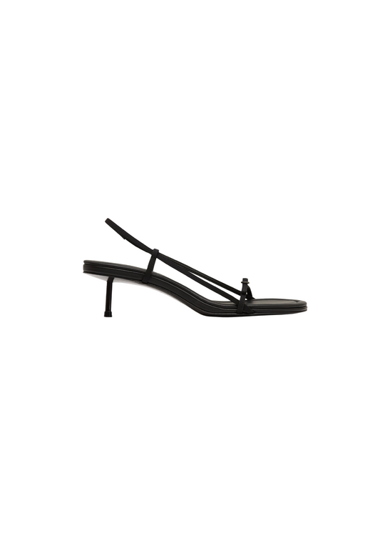Black sandal with thin straps on a white background