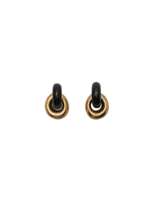 Pair of gold and black earrings on a white background
