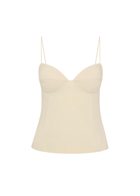 Beige slip top with thin straps on a white background