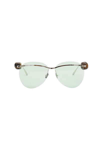 Sunglasses with brown frame and clear lenses on a white background