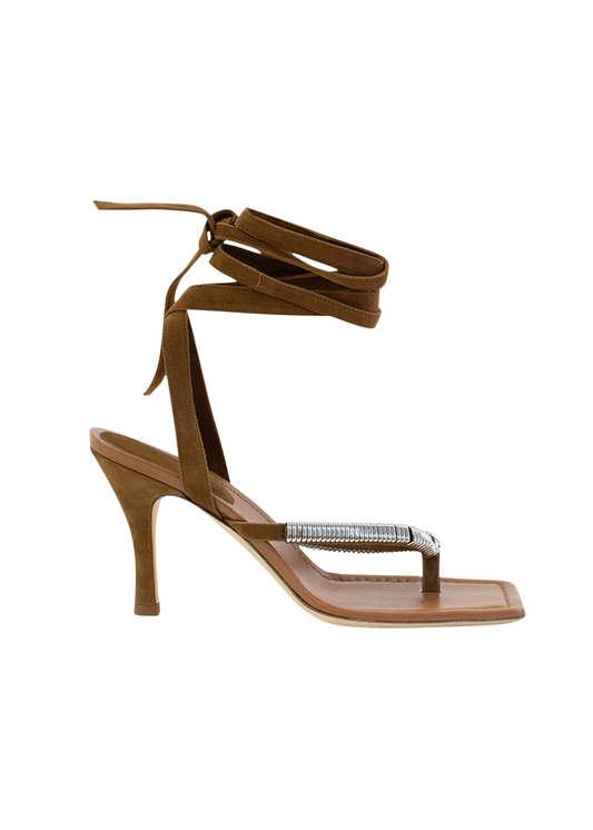 Brown high-heeled sandal with clear toe and ring detail on a white background