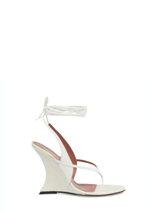 White high-heeled sandal with ankle strap on a white background