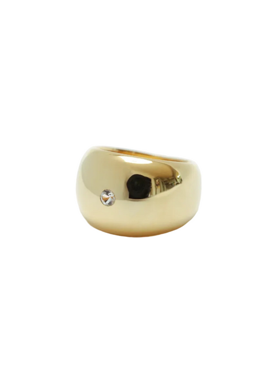 Gold ring with a diamond on a white background