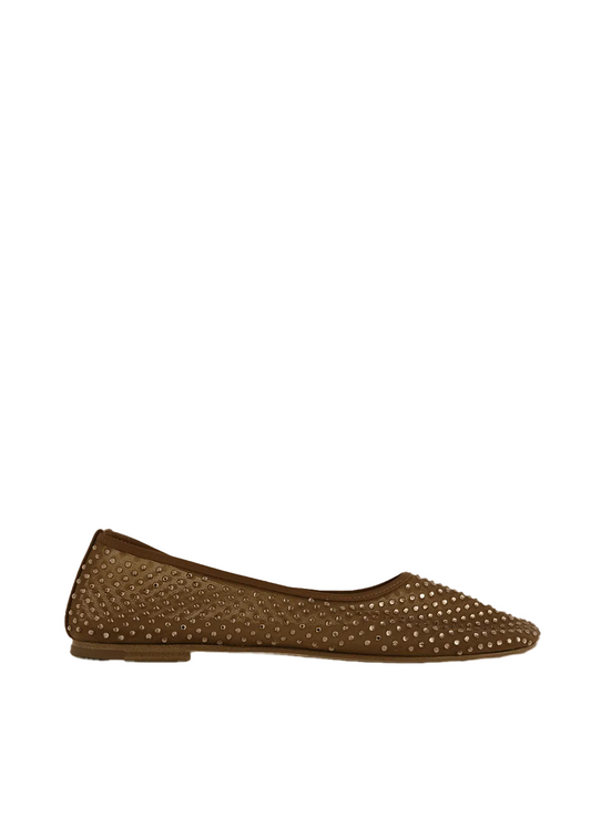 Brown studded flat shoe on a light beige background