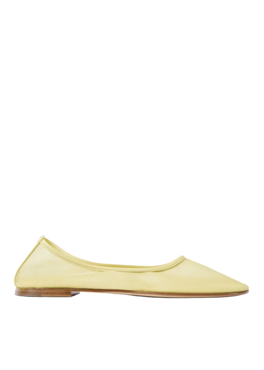 Yellow flat shoe on a white background