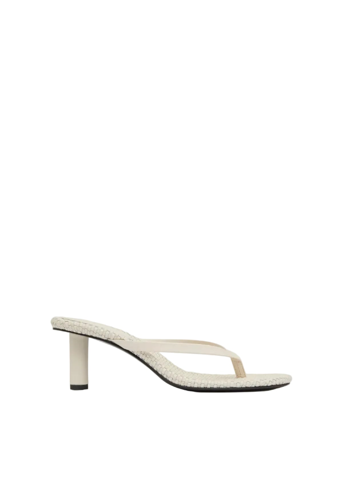 White sandal with a thin strap on a light gray background