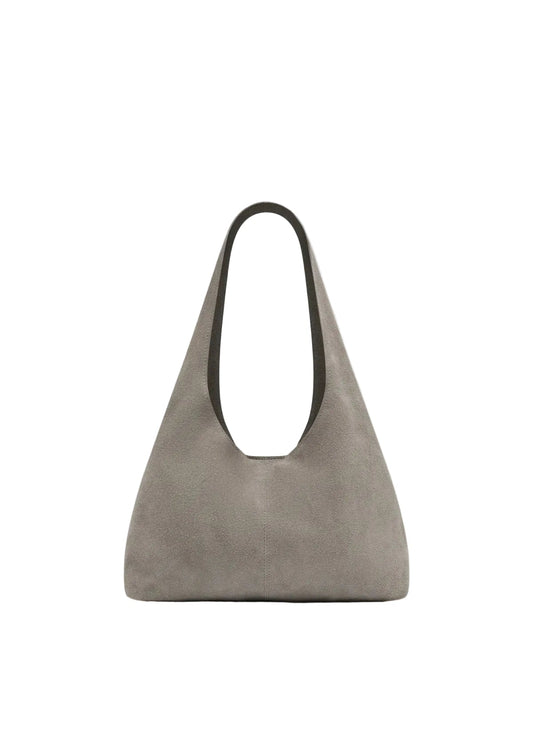 Beige handbag on a light gray background
