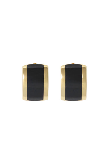 Pair of gold and black earrings on a light gray background
