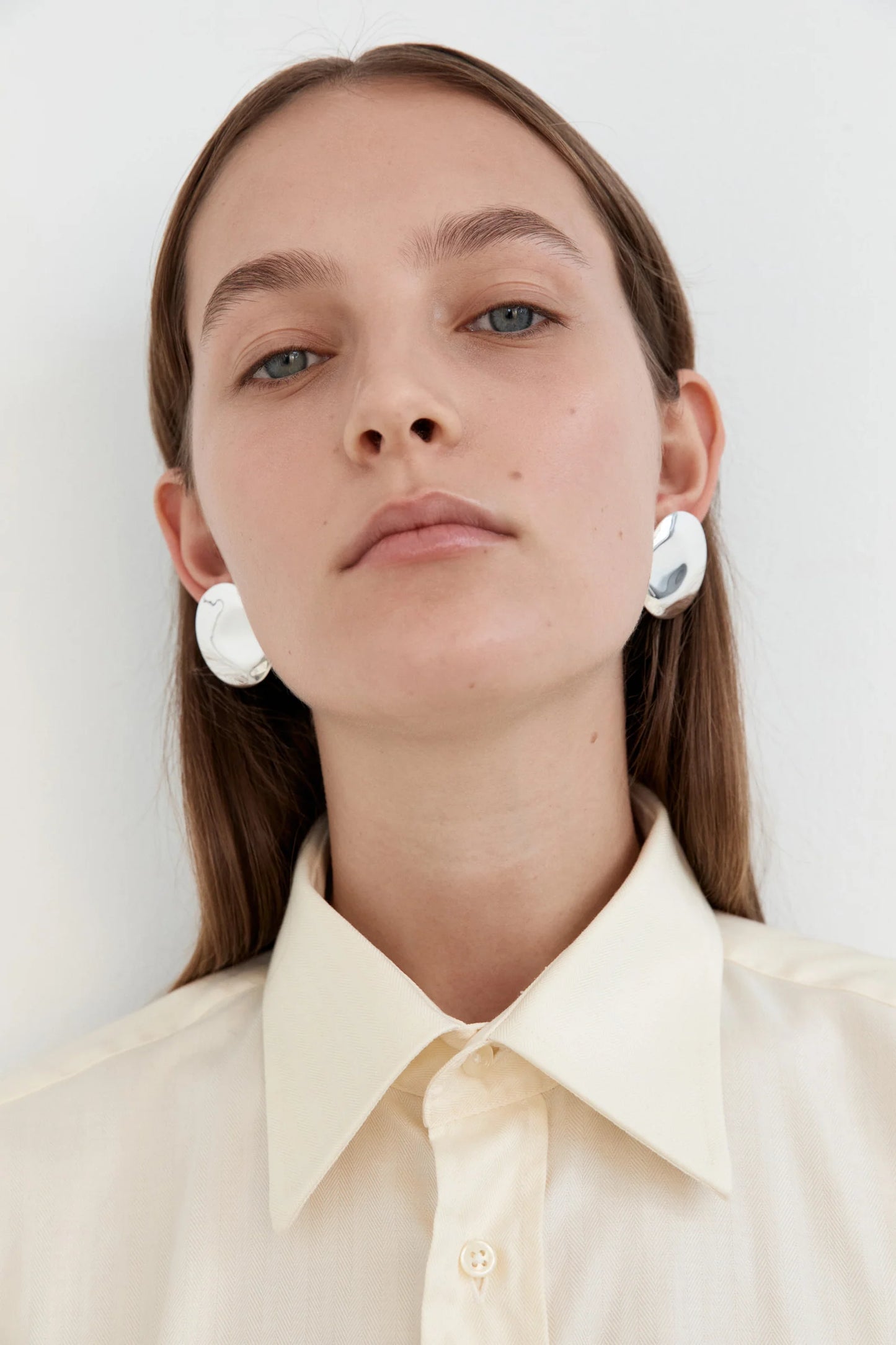 Dented Medallion Earrings in Silver