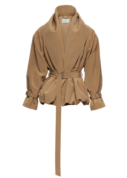 A tan belted wrap jacket with a high shawl collar and gathered peplum hem, shown against a plain white background.