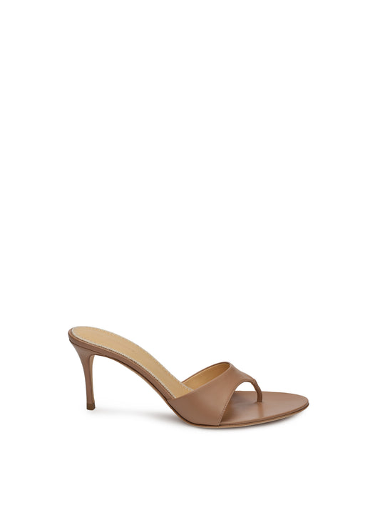 Tan high-heeled sandal on a white background