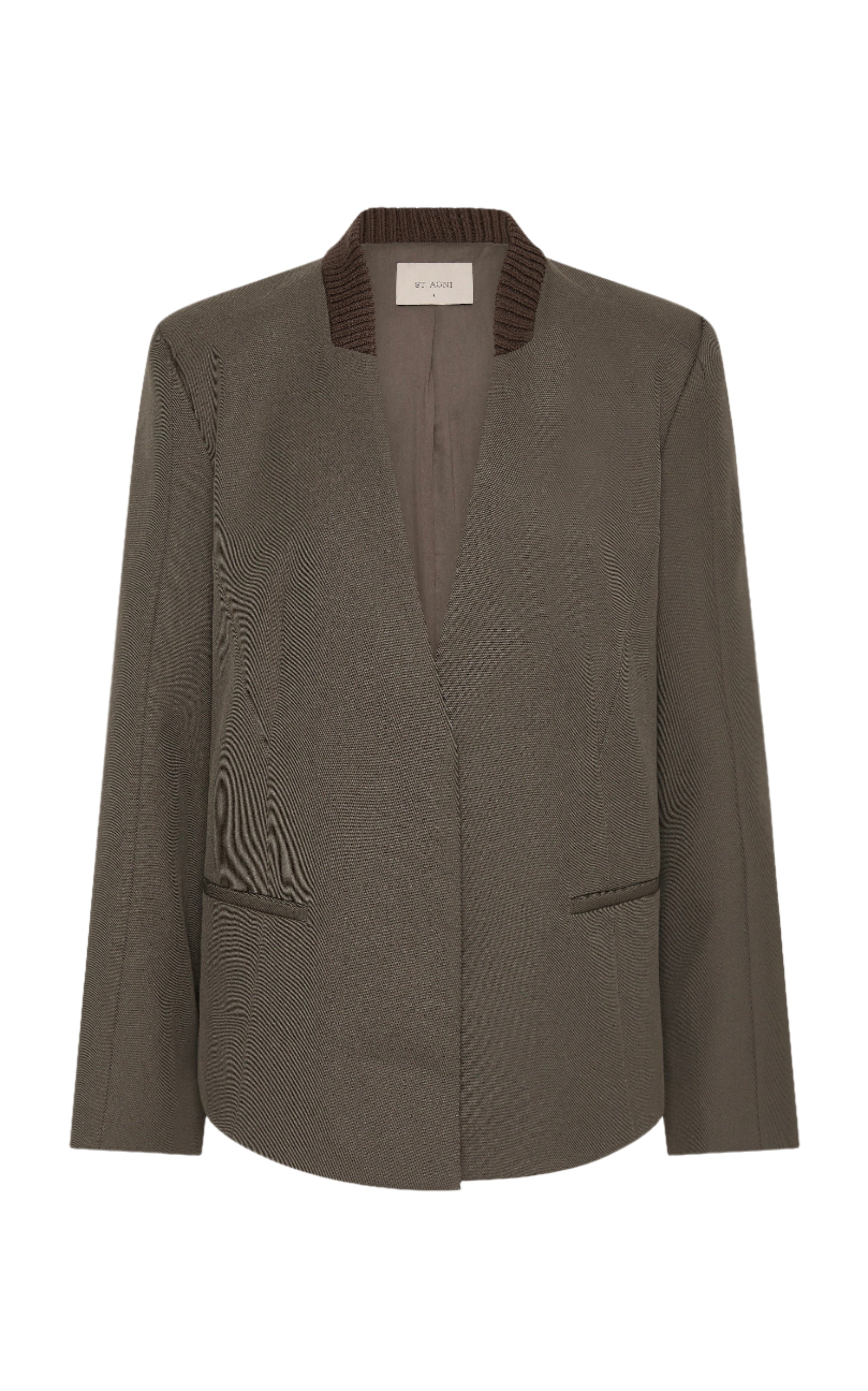 Dark green blazer with textured collar on a white background