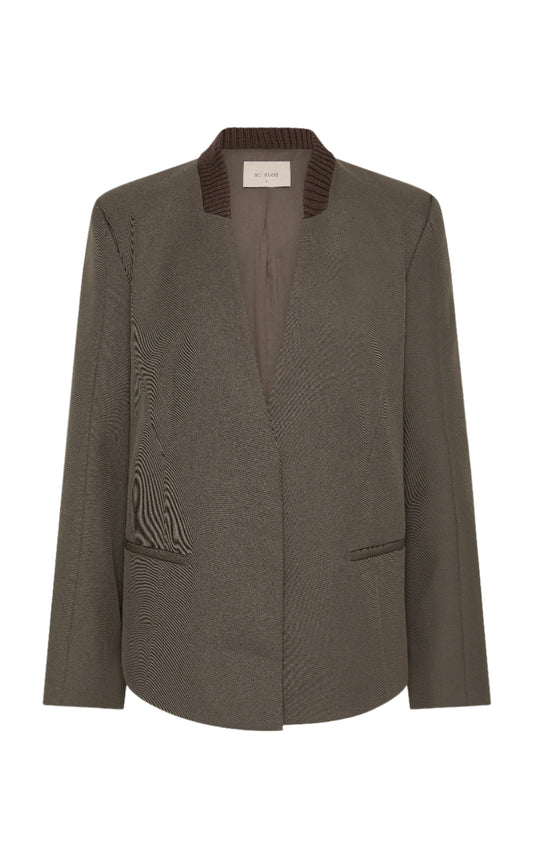 Dark green blazer with textured collar on a white background