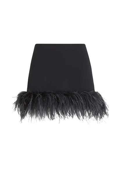 Merdulie black mini skirt with a dramatic feather trim hem, featuring a sleek and fitted silhouette for evening wear.