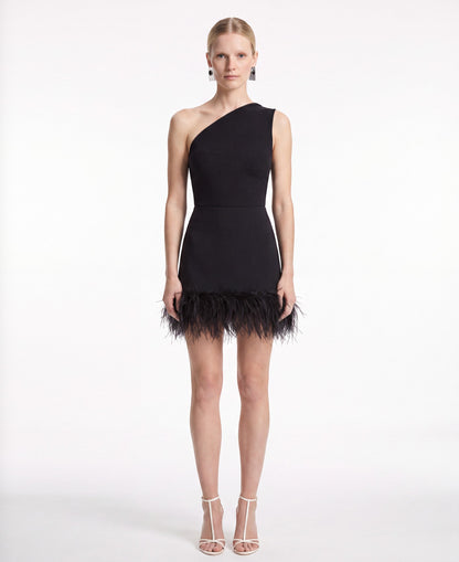 Merdulie black mini skirt with a dramatic feather hem and fitted silhouette worn by a model on a white background
